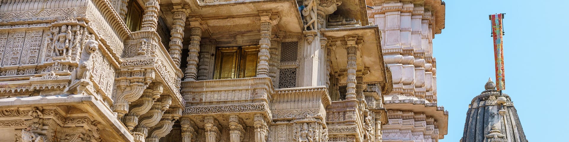 Intricate temple architecture with detailed carvings and a prominent spire.