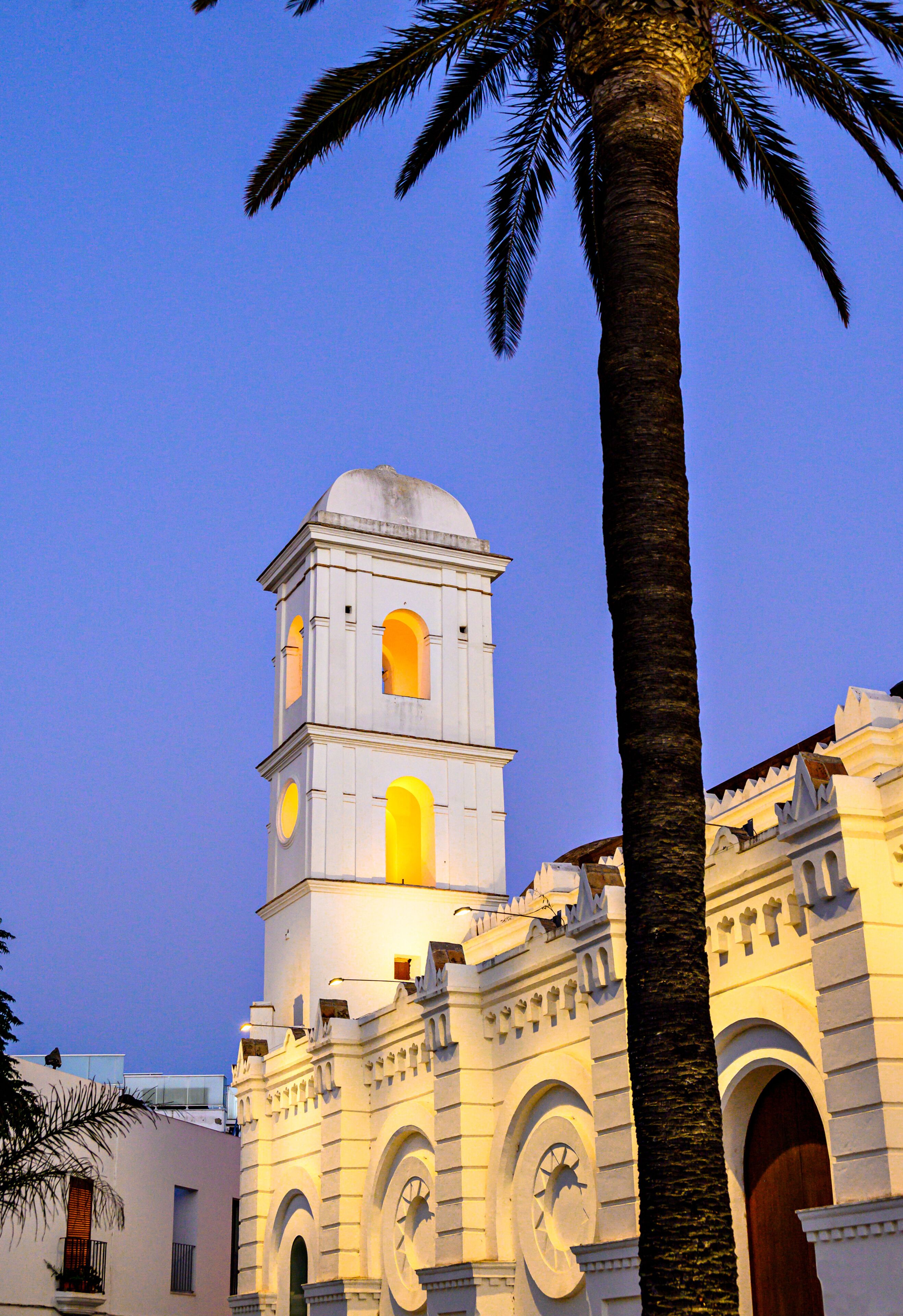 Vertical sunset shot of the Iglesia de Santa Catalina in Conil de la Frontera, Cadiz, Spain.
