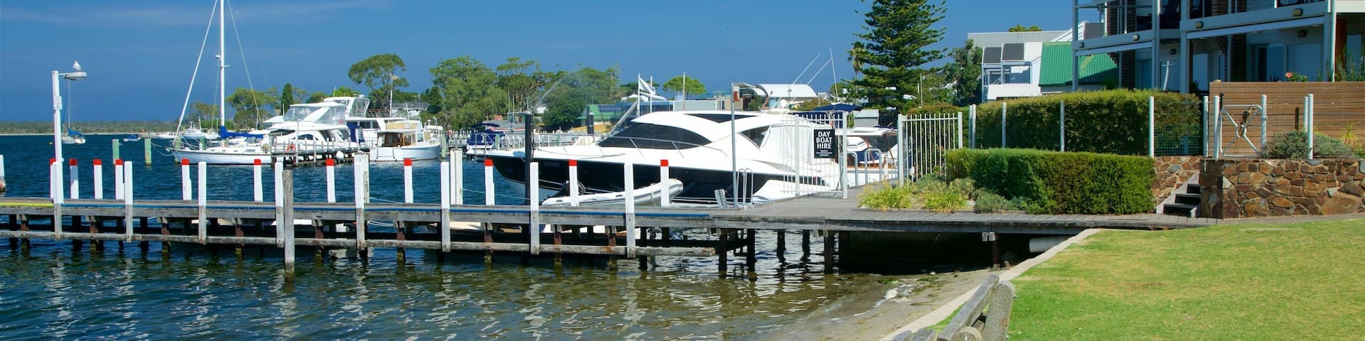 Metung featuring a marina, a bay or harbour and a coastal town