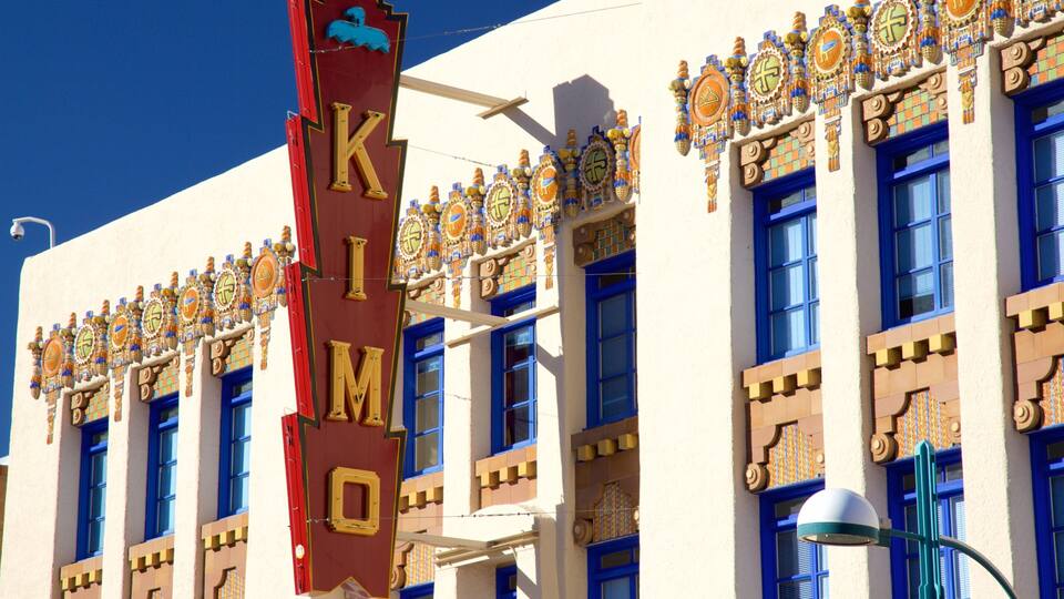 A building with a large sign reading "KIMONO" and blue windows.