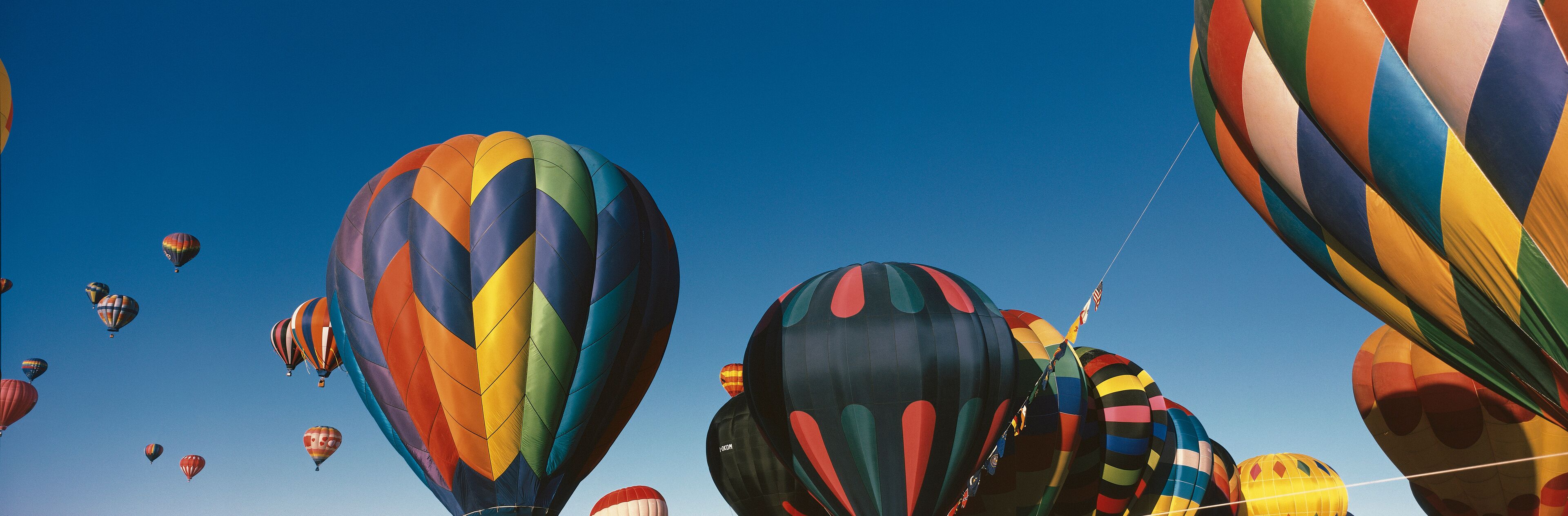 This is the 25th Annual Albuquerque International Balloon Fiesta. It shows the mass ascension of colorful balloons.