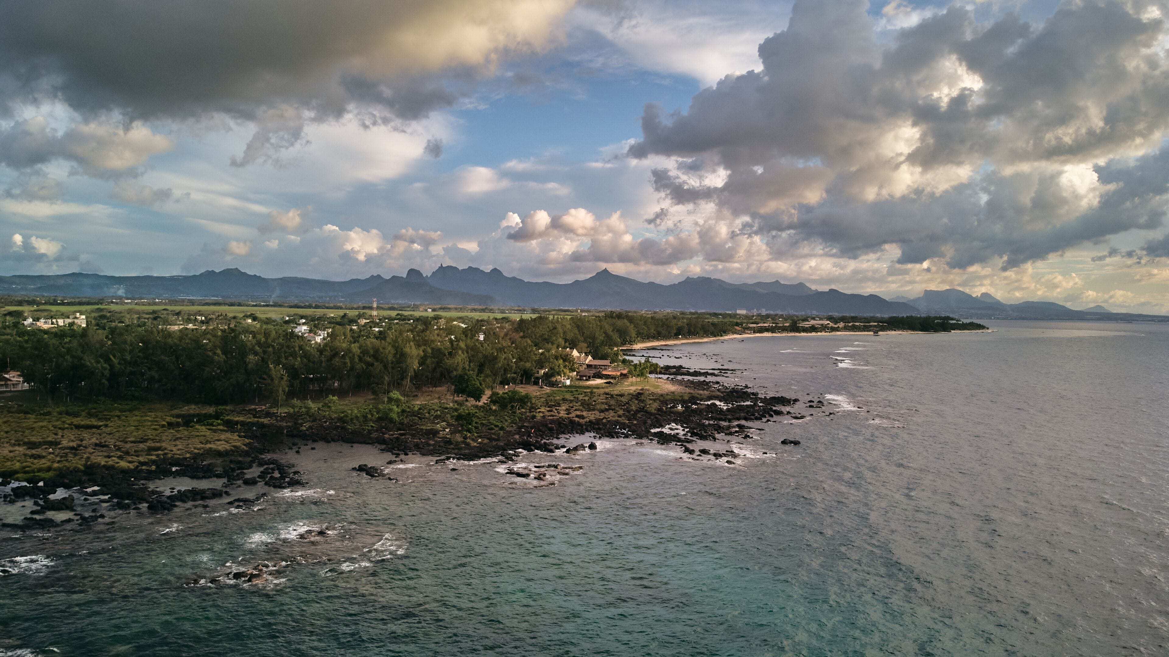 Aerial view in Mauritius over Pointe aux Piments beach at sunset, a beautiful tropical beach in the Indian Ocean