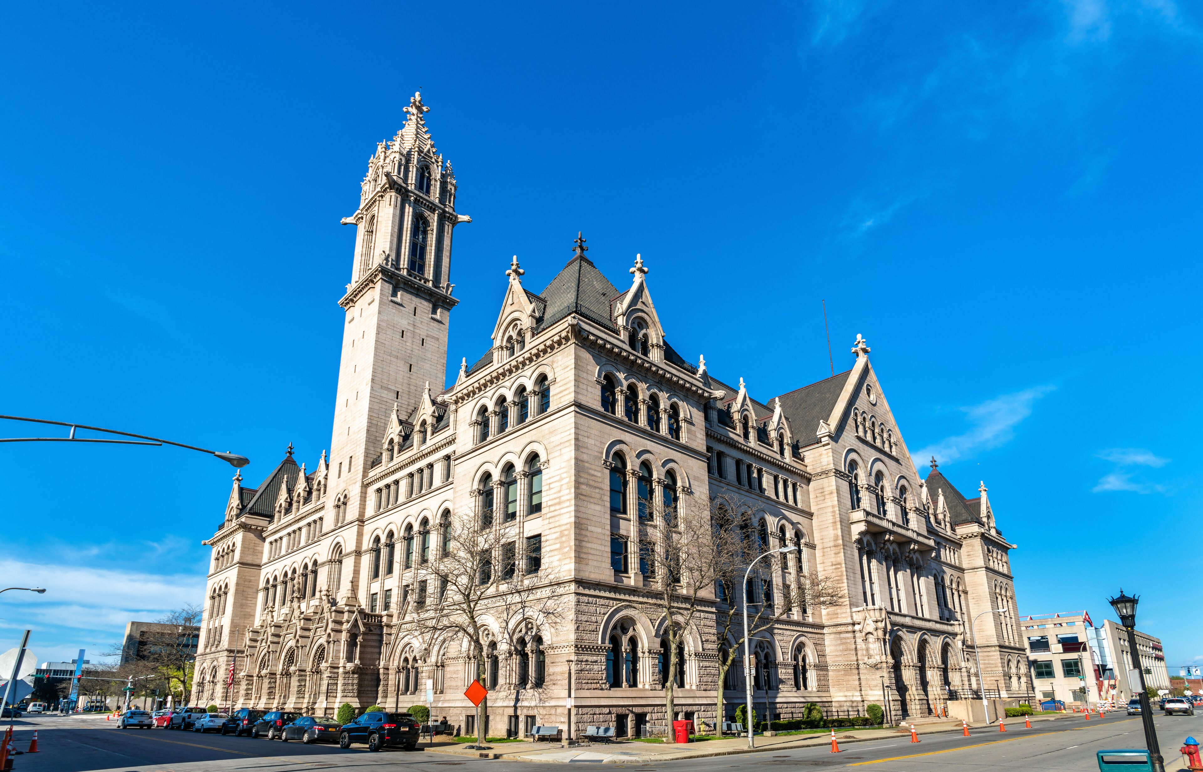 A large, historic building with intricate architecture and a tall tower.