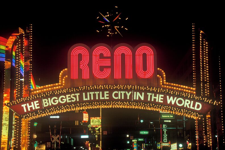 A brightly lit sign reading "Reno" with the text "THE BIGGEST LITTLE CITY IN THE WORLD" underneath.