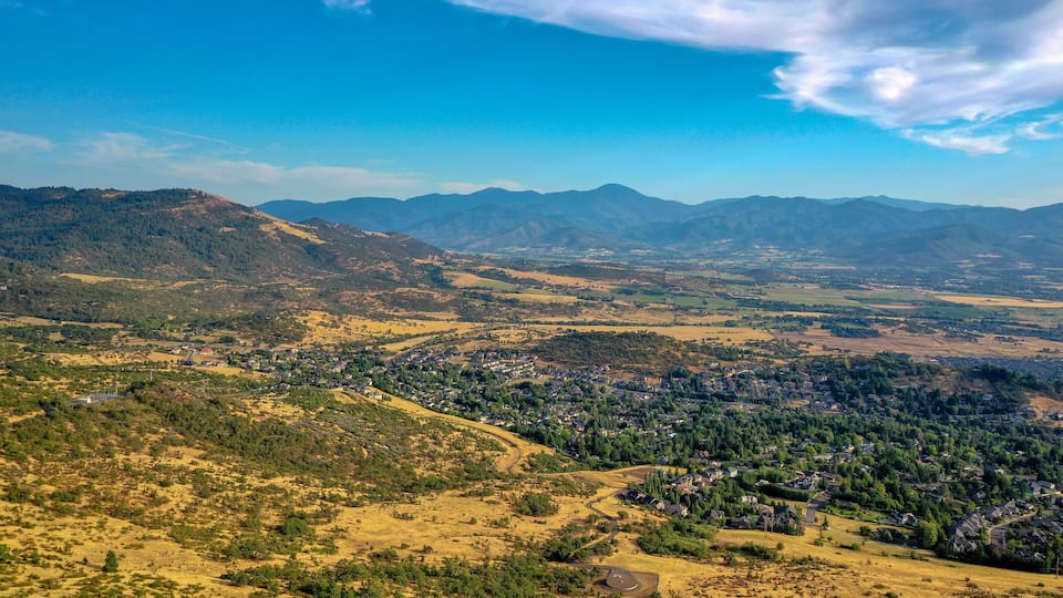 A mountainous landscape with a town nestled among the hills.
