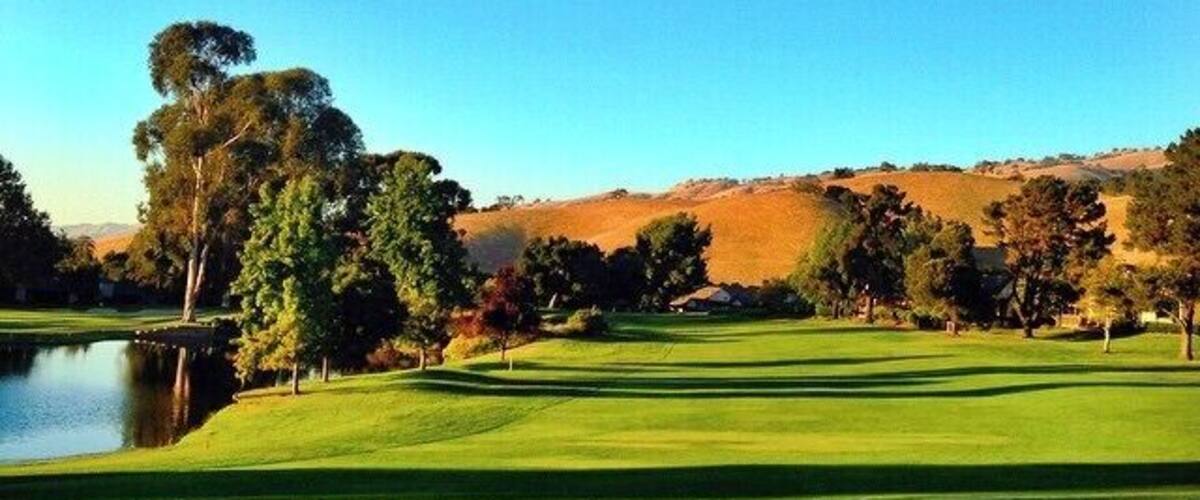 The sky is so blue, the grass so green, and the weather is perfect with no humidity. This area is one to sit outside and enjoy the weather with a cup of tea or coffee. It's perfect to watch the sun set and the geese or ducks swimming in the lake. And, I suppose, if you're up for it -- the golf course is pretty good too.