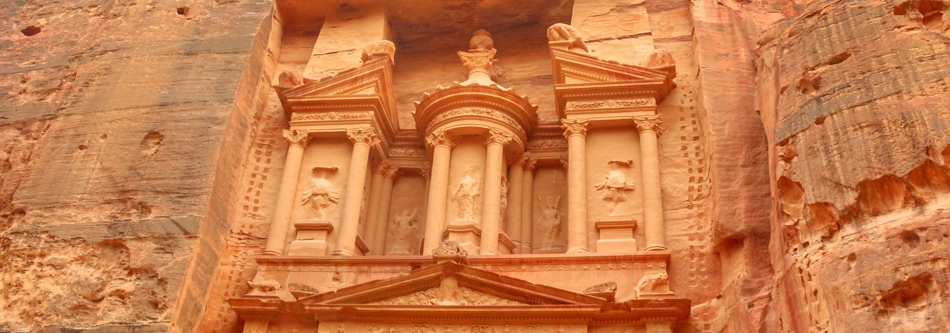 Banner panorama of The Treasury in Petra in Jordan, an archaeological site and one of most popular tourist attractions carved out of a sandstone rock. Architecture details background.