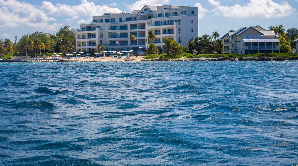 North Side Starfish point rum point Grand Cayman Cayman Islands view from the Caribbean sea ocean with shore and hotel building structure in the distance