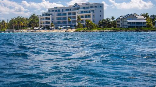 North Side Starfish point rum point Grand Cayman Cayman Islands view from the Caribbean sea ocean with shore and hotel building structure in the distance