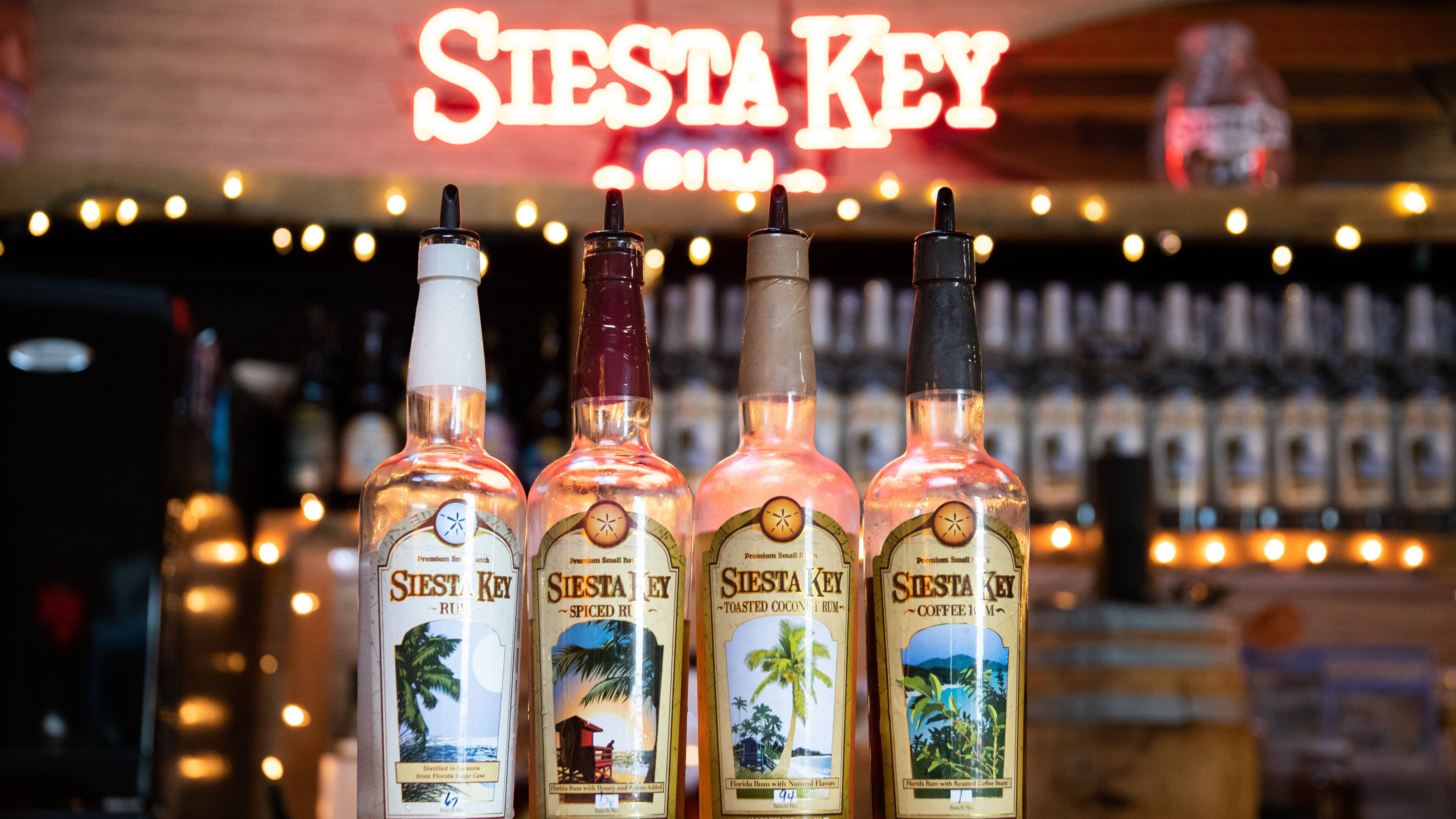 Sarasota which includes a bar, drinks or beverages and interior views