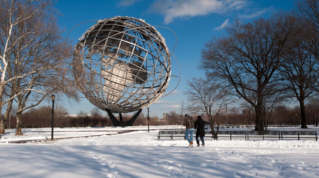 Corona featuring snow and a statue or sculpture as well as a couple