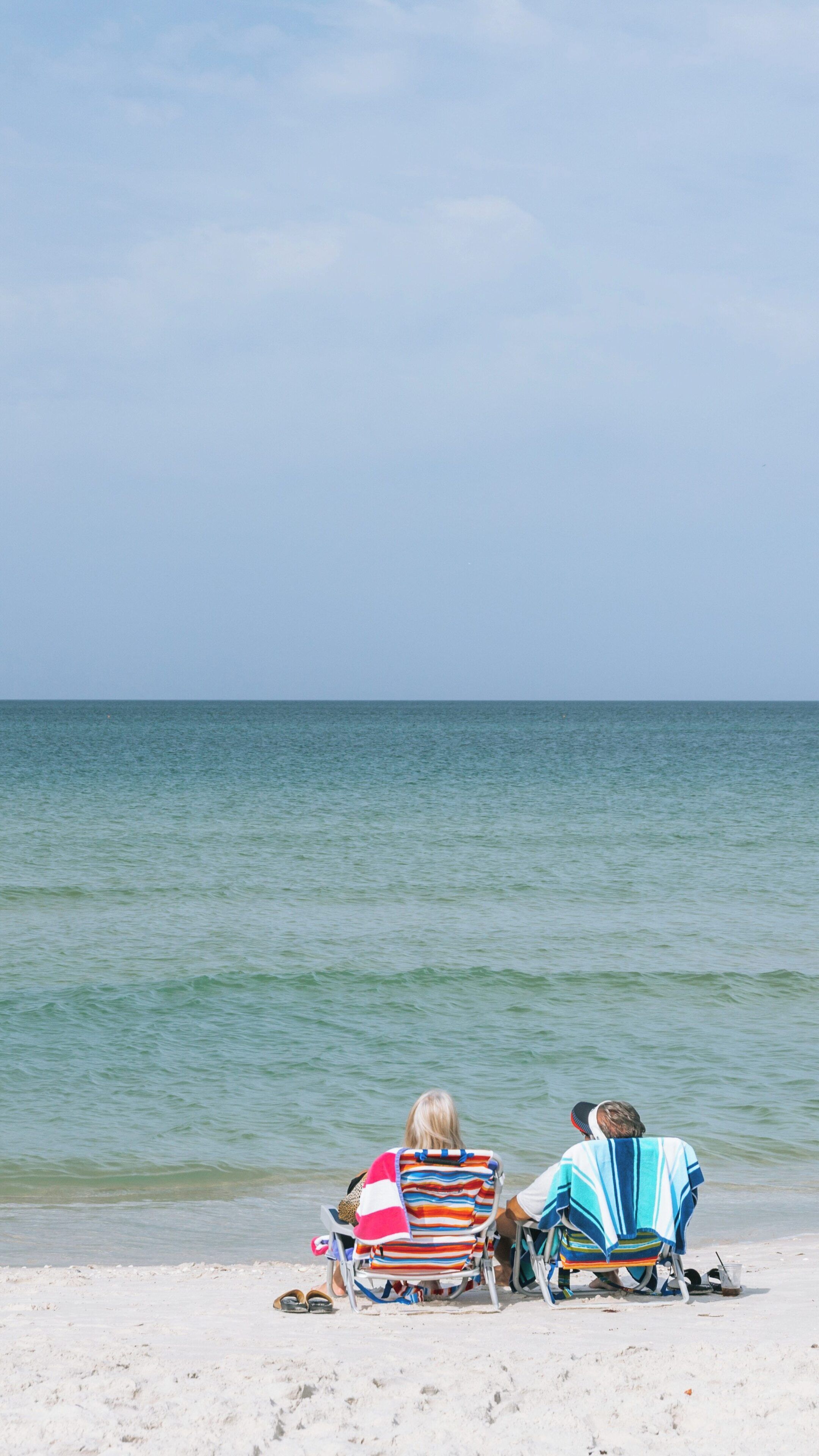Relaxing beach day at Clam Pass Park in Pelican Bay, Naples, Florida with ocean views and gentle waves under a clear sky