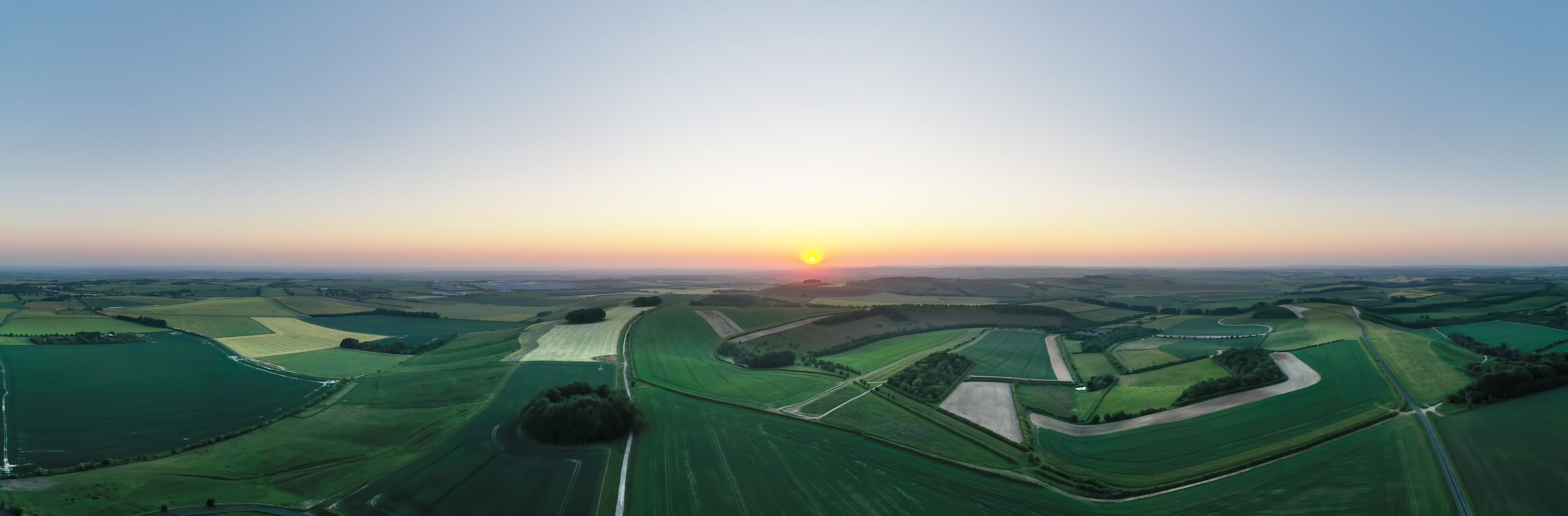 Aerial panorama view of  sunrise over the Ridgway near Swindon, Wiltshire