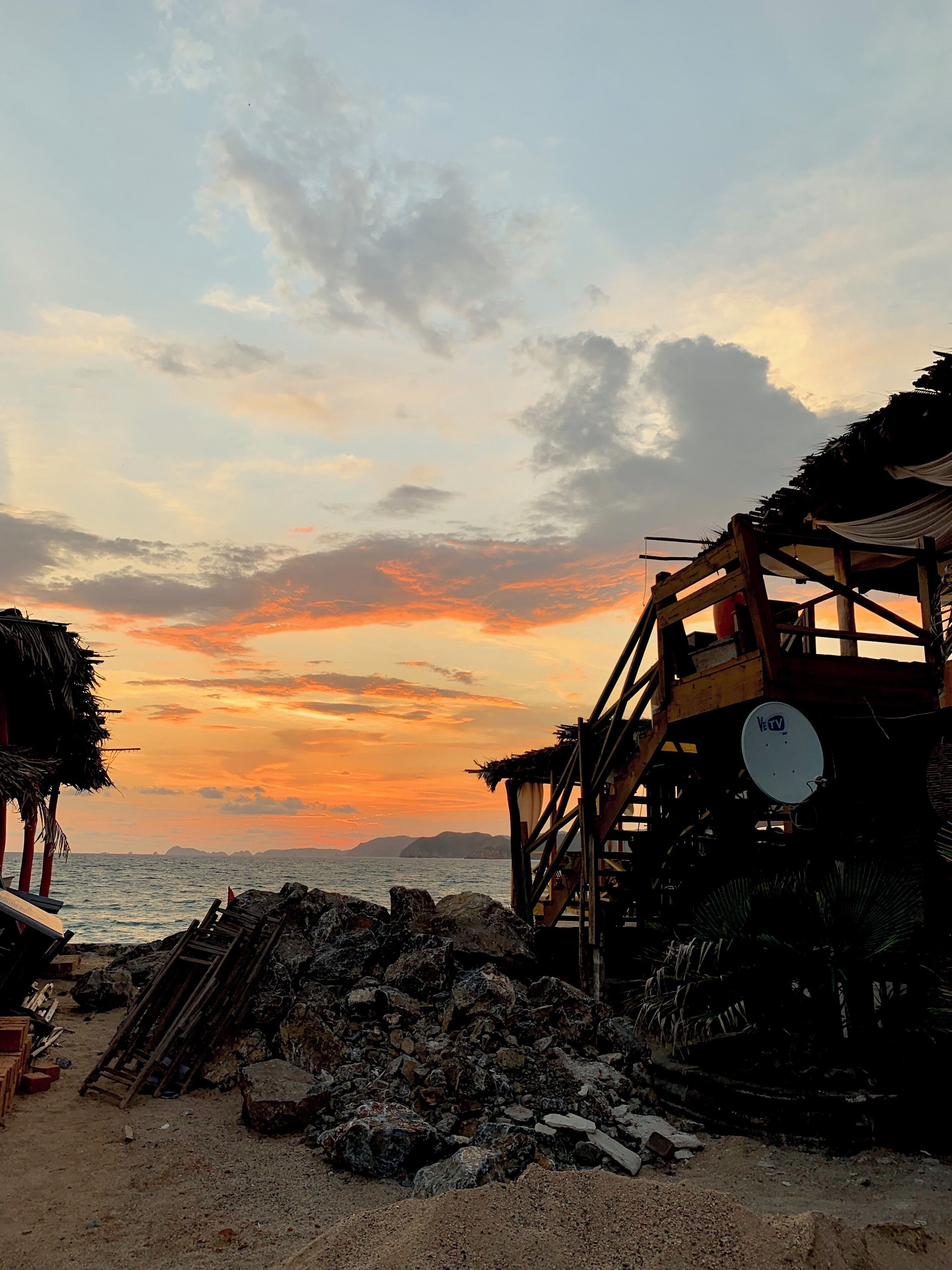 If you surf, this beach is perfect for you and this time of day is their favorite time to surf because the waves get higher plus they have a lovely view of the sunset #sunset #colourful #colors #colour #sky #debris
