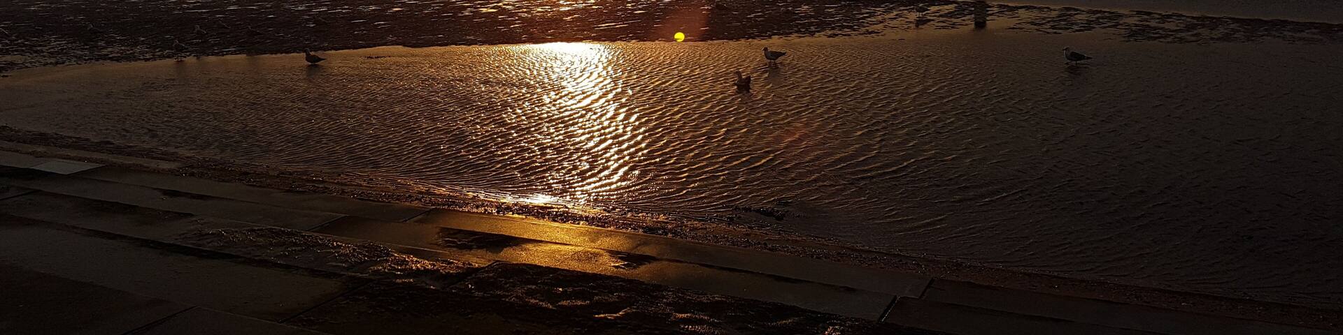 Sunset over Margate Harbour at low tide