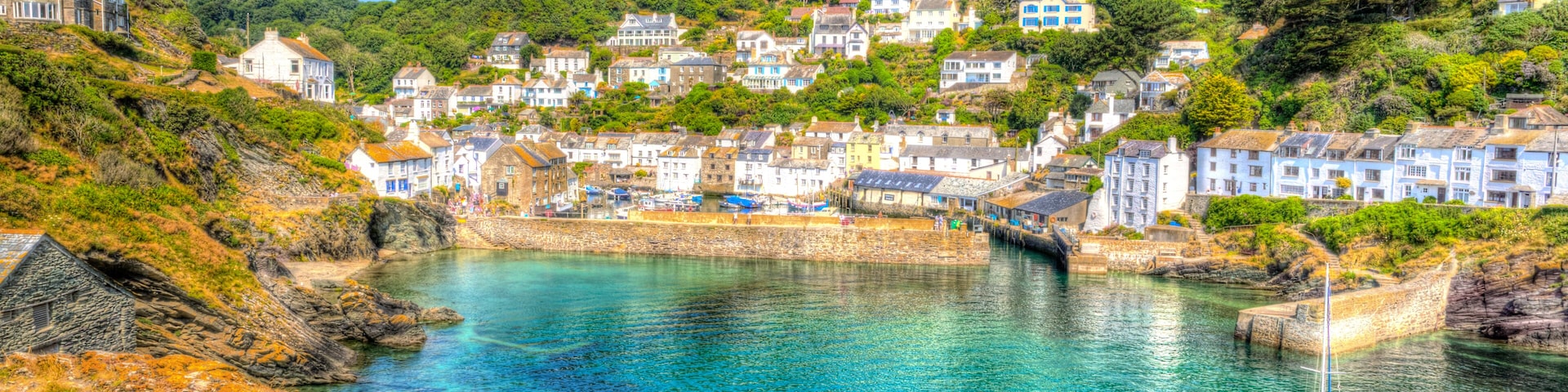 Polperro harbour Cornwall England with clear blue and turquoise sea in vivid colour HDR like painting
