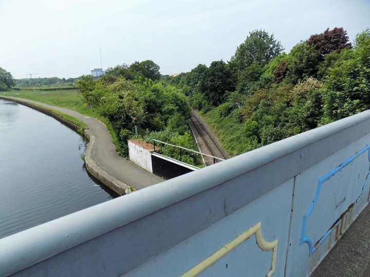 A road bridge over a canal over a rail track
part of the grand union canal