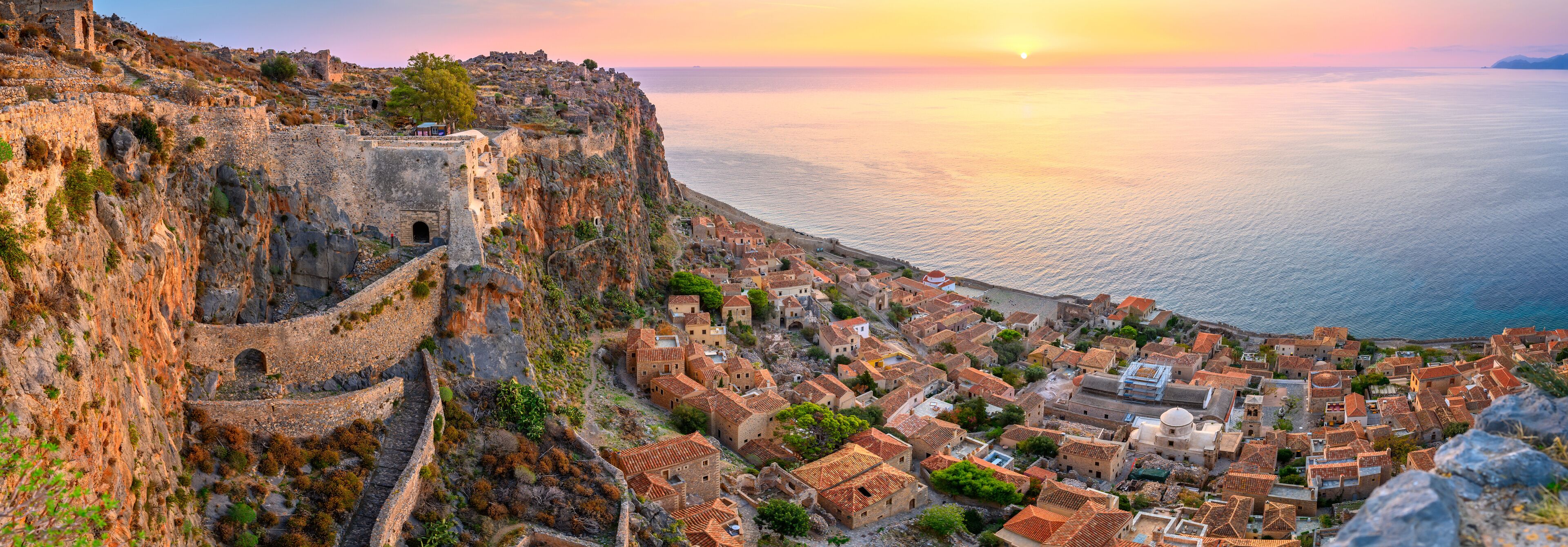 picturesque parorama old medieval castle town of Monemvasia in Lakonia at sunrise, Peloponnese, Greece. "Greek Gibraltar"