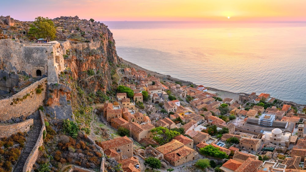 picturesque parorama old medieval castle town of Monemvasia in Lakonia at sunrise, Peloponnese, Greece. "Greek Gibraltar"