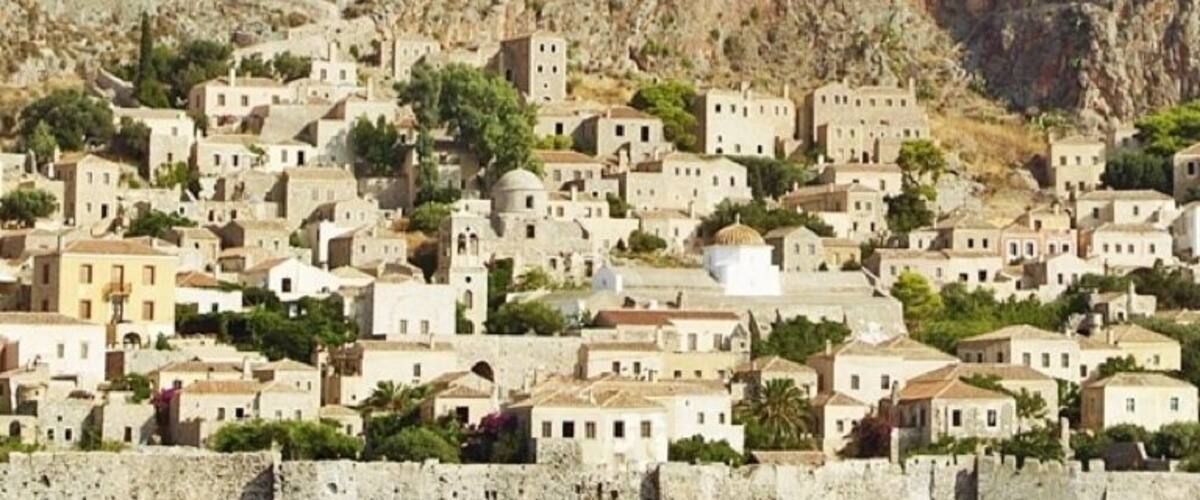 The fortified town of Monemvasia sits upon a rocky peninsula off the east coast of the Peloponnese. Though the 300ft (100m) cliffs proved difficult to conquer, it's strategic position made it a pawn during treaty negotiations.
The lower town and cliff-top fortress were founded in the 6th century and initially served as a refuge during the Slavic and Avaric invasion of Greece. Later, the fortress withstood Arab and Norman invasions in 1147, but finally fell to Achaea after a three year siege in 1248. Over the next few hundred years it was ruled by the Byzantine Empire, then the Vatican, the Venetians, the Ottomans and finally the Greeks.
Today, the lower town has become a quaint tourist village while the upper fortress lies largely in ruins. It's worth the climb up though just to wander the walls and enjoy the views. Watch your step though - you don't want to fall into an ancient cistern!
Monemvasia is a worthy overnight stay. If you aren't up for driving, hop a 4 hour ferry from Athens.