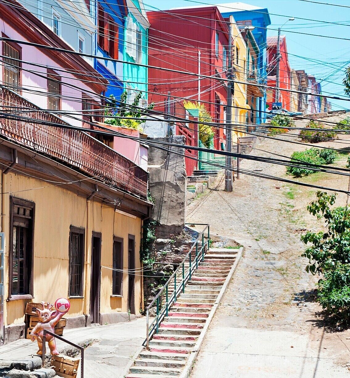This photo really sums up the old neighborhoods of Valparaíso - colorful homes, a nest of electrical wires, and a steeply raked, overgrown cobblestone street. These neighborhoods were highly desirable during the city's golden age (1848-1914) when it was a popular stop for ships rounding South America and was known as "The Jewel of the Pacific".  A major earthquake in 1906 and the opening of the Panama Canal in 1914 doomed the city for decades.  Today, much of the city has been declared a UNESCO World Heritage Site and is seeing a resurgence in tourism and gentrification.