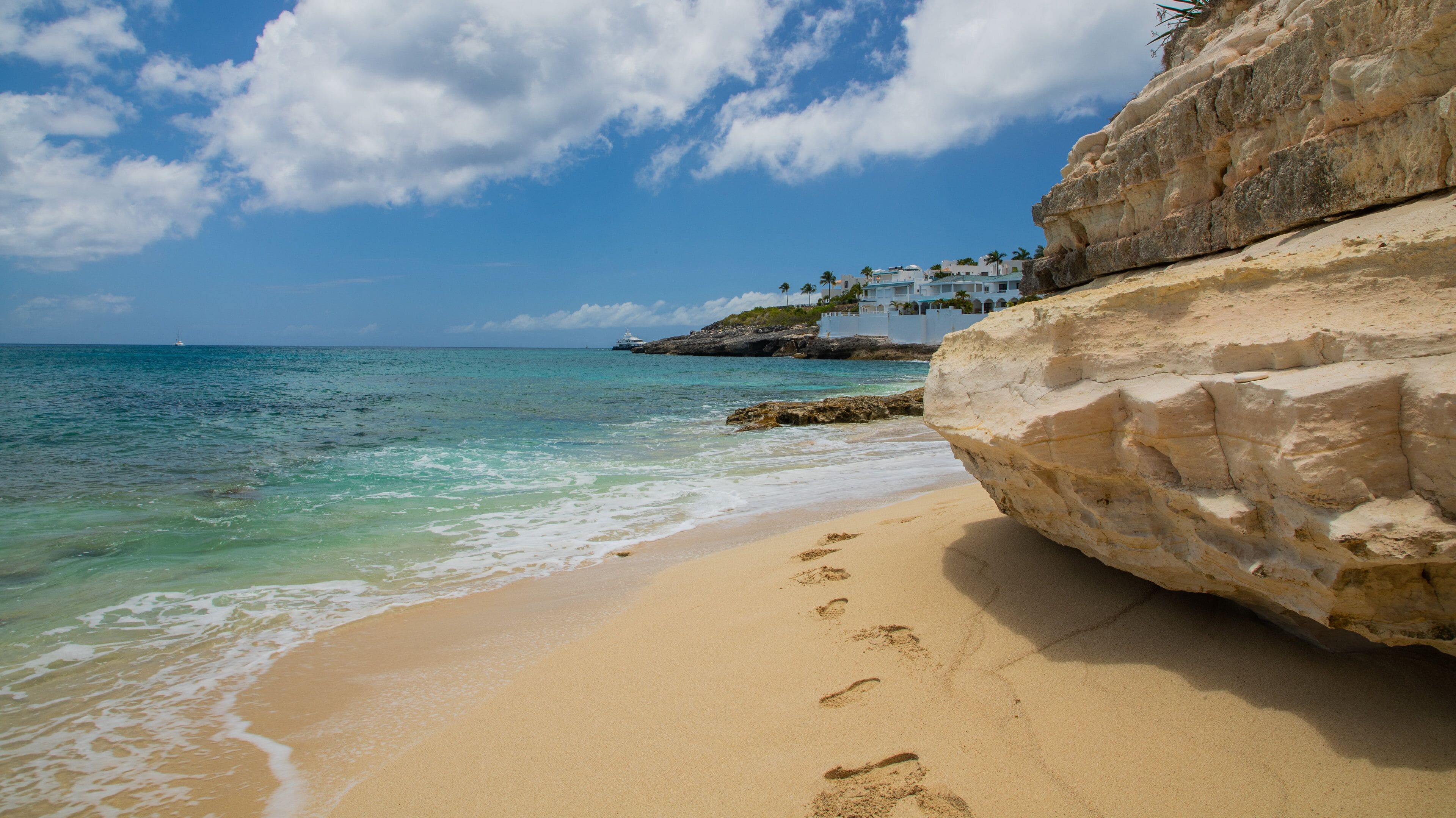 Cupecoy showing general coastal views and a sandy beach