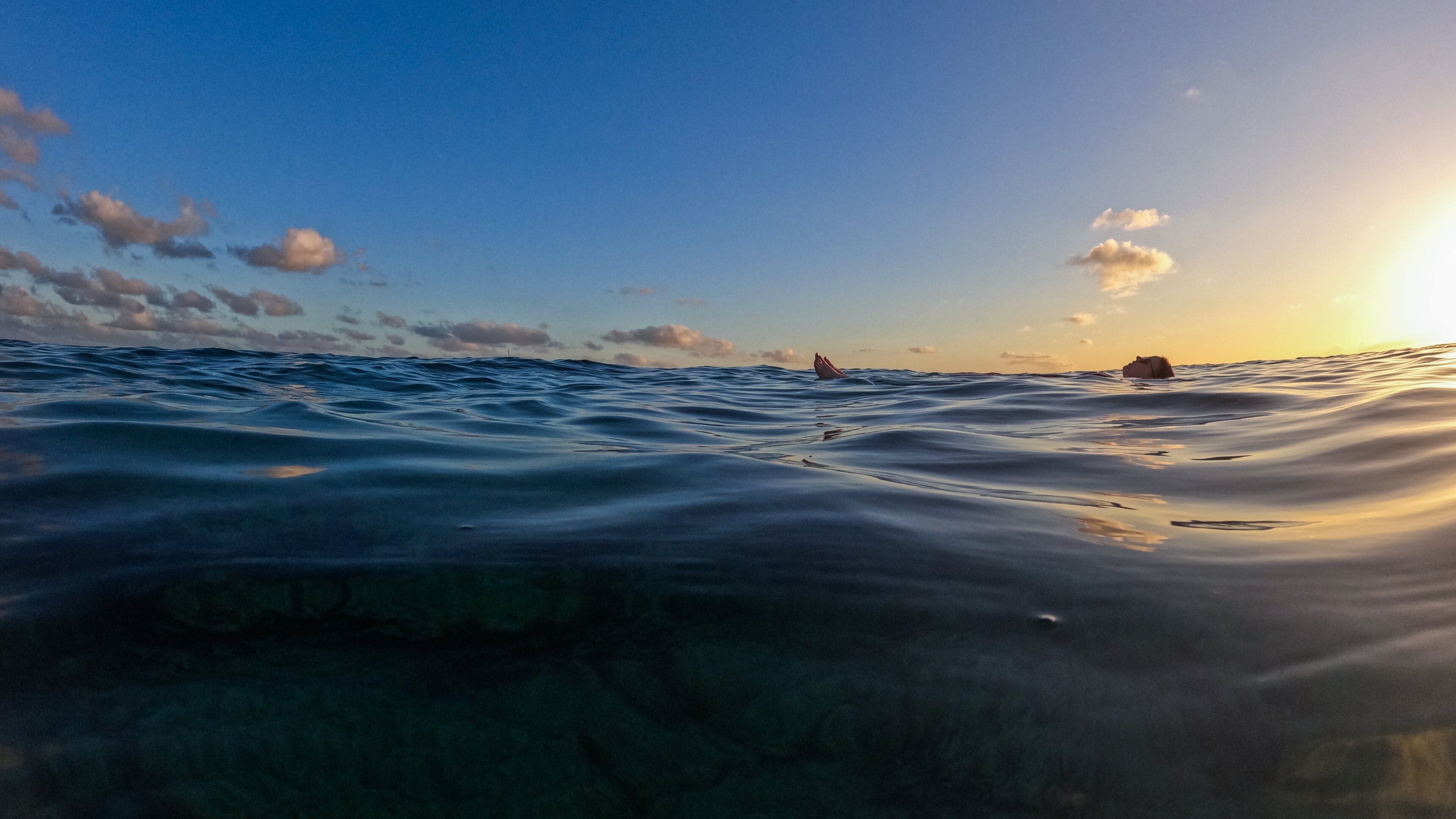 Cupecoy which includes general coastal views and a sunset