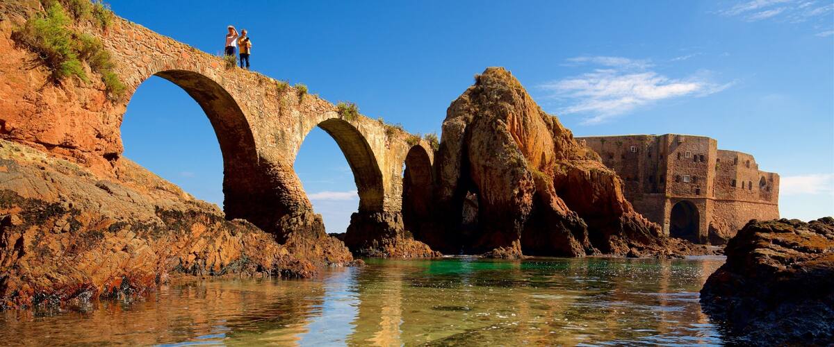 Berlenga Island showing a bridge, rocky coastline and heritage elements