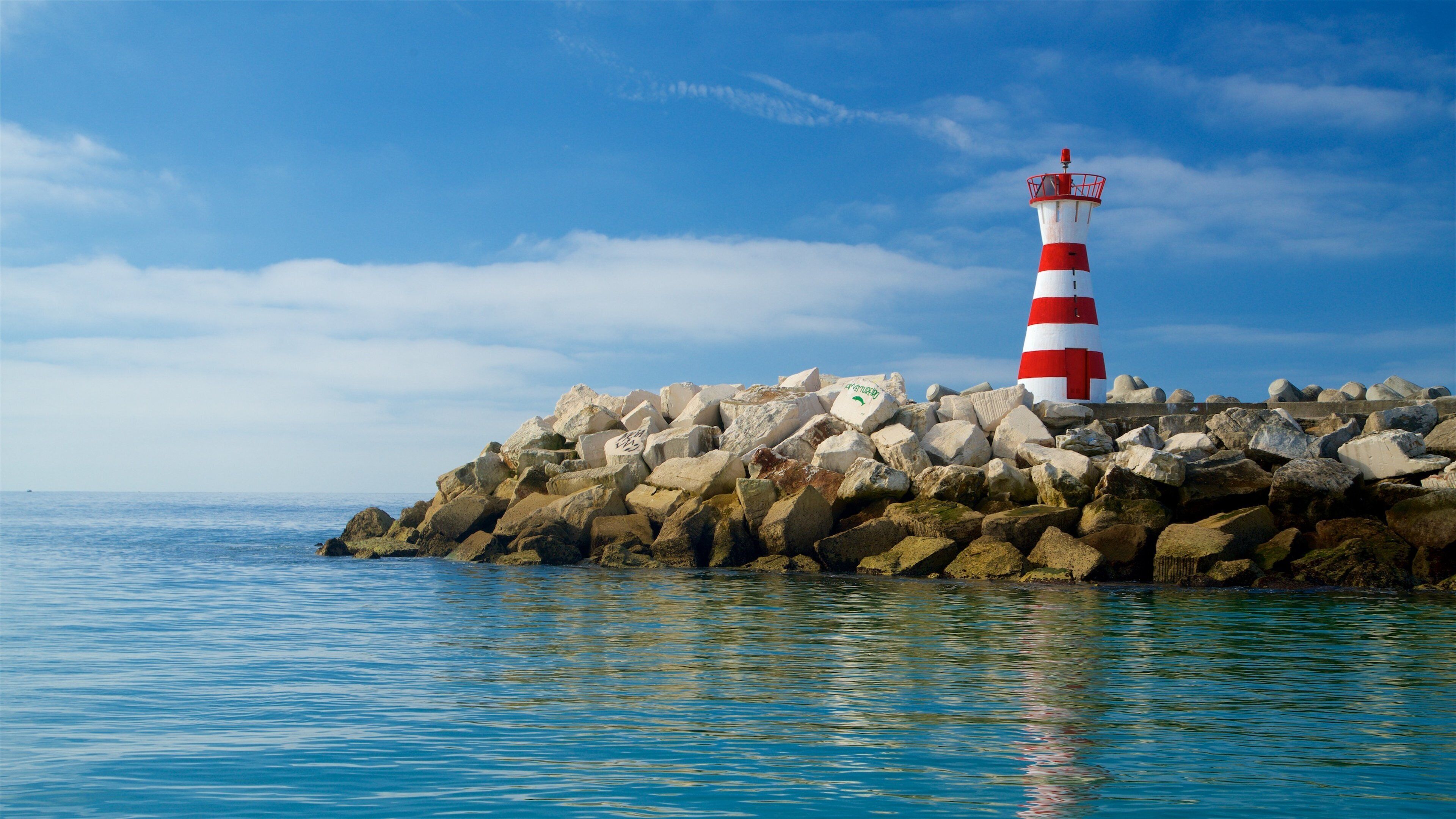 Peniche which includes rugged coastline, general coastal views and a lighthouse
