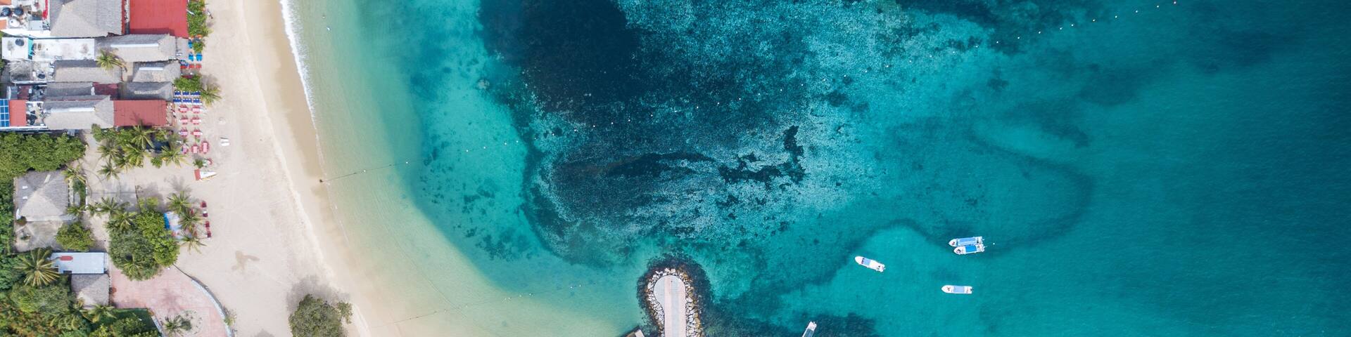 Aerial view of Santa Cruz Huatulco Bay on a sunny day in Oaxaca, Mexico