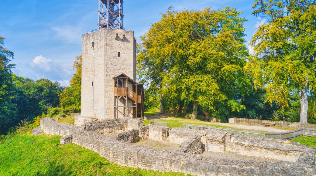 More than 1000 years old castle ruins with destroyed walls and a wooden viewing platform