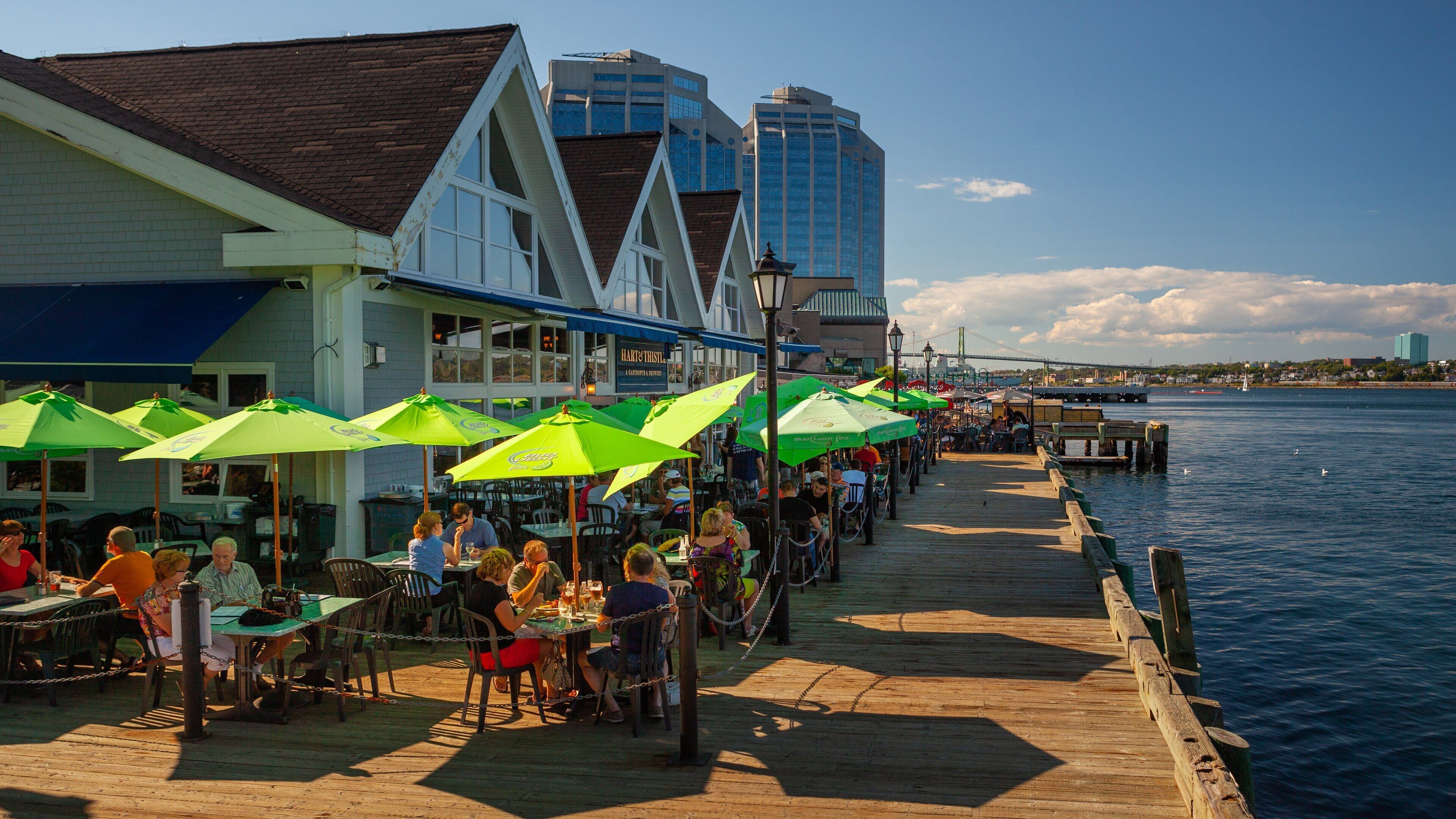 Halifax which includes a bay or harbor and outdoor eating as well as a small group of people