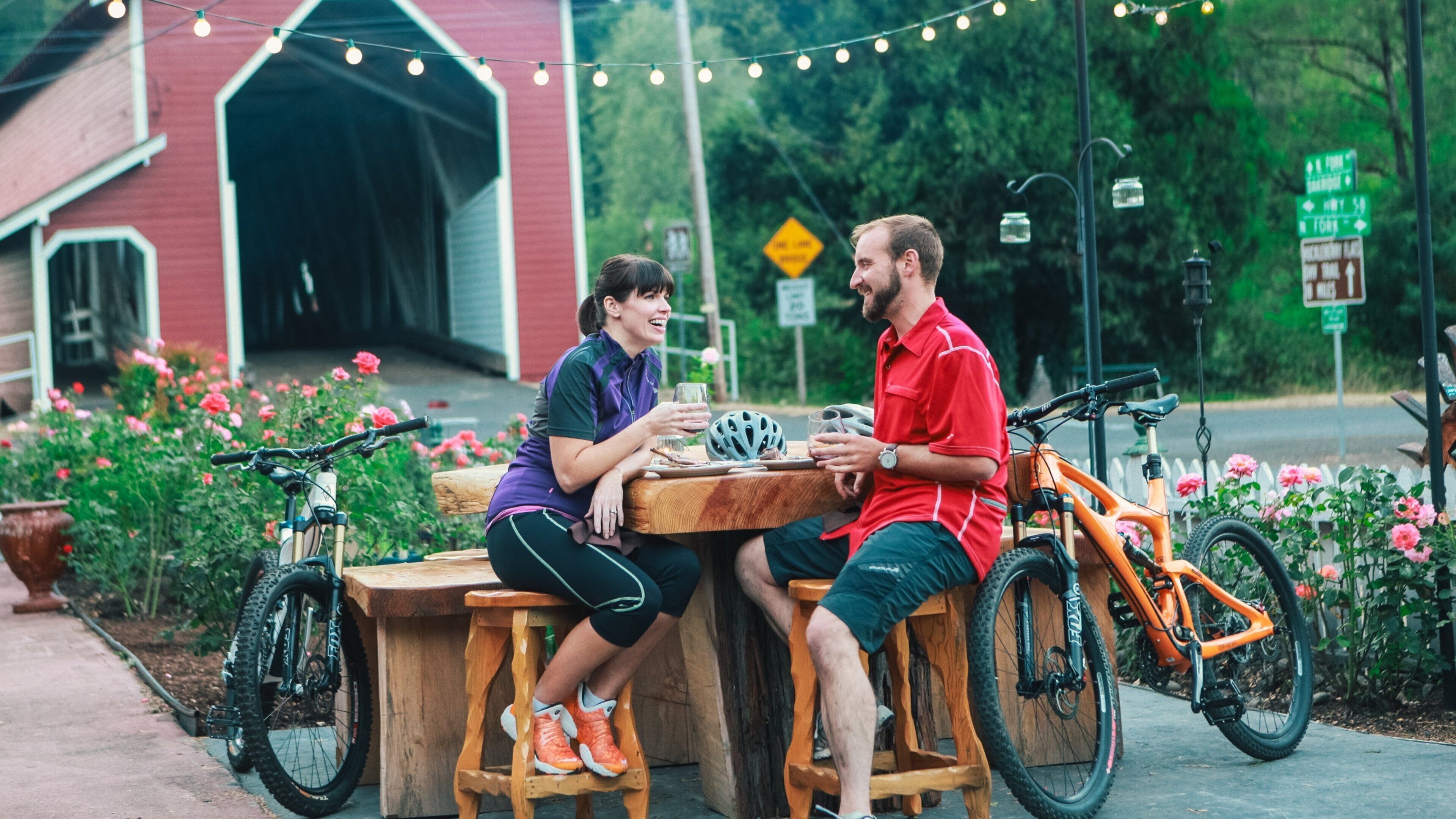 Eugene featuring a garden and outdoor eating as well as a couple