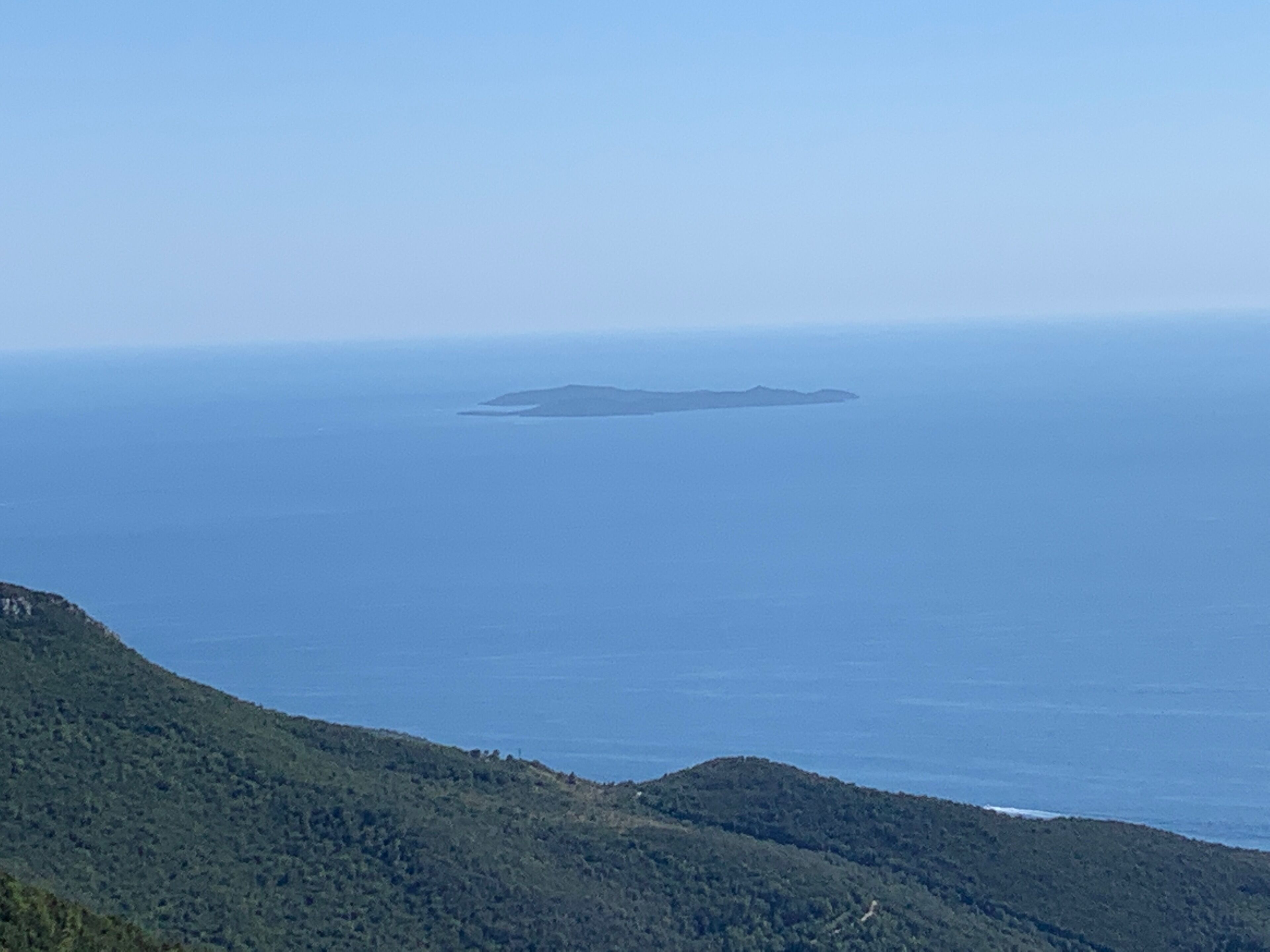 View of Giglio island and pristine Montecristo in the back from atop Monte Argentario. You must drive 10km towards the Convento della Presentazione al Tempio then once at the church take a visit and see the view there then drive additional 5km to reach the top of the mountain.