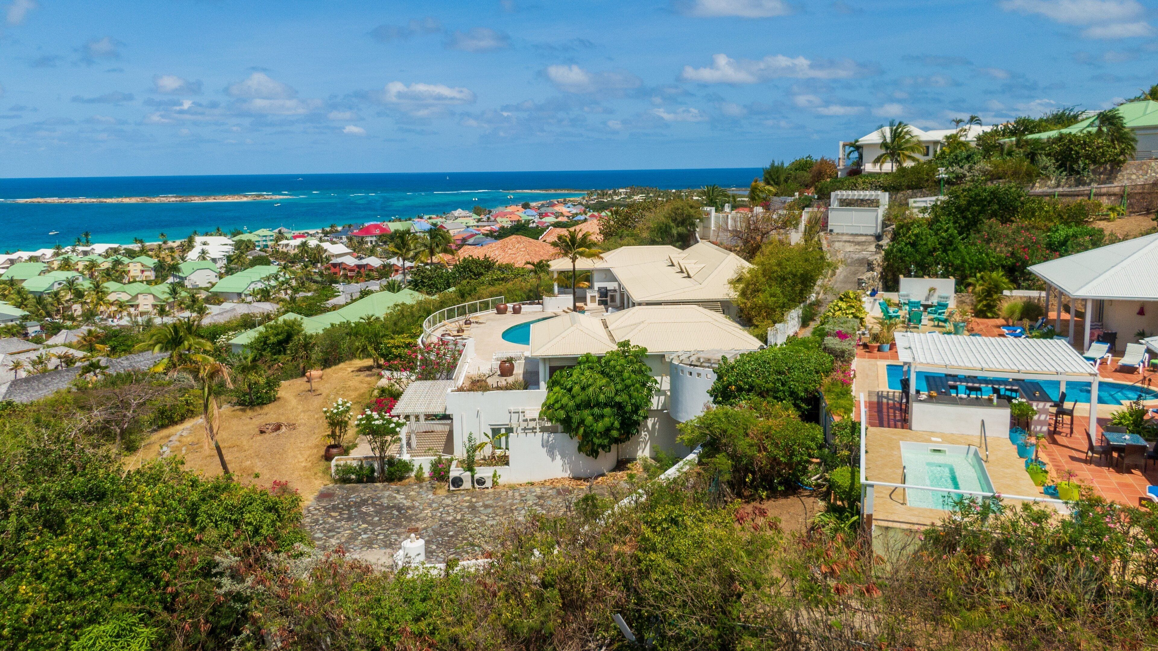 Orient Bay which includes a coastal town and landscape views