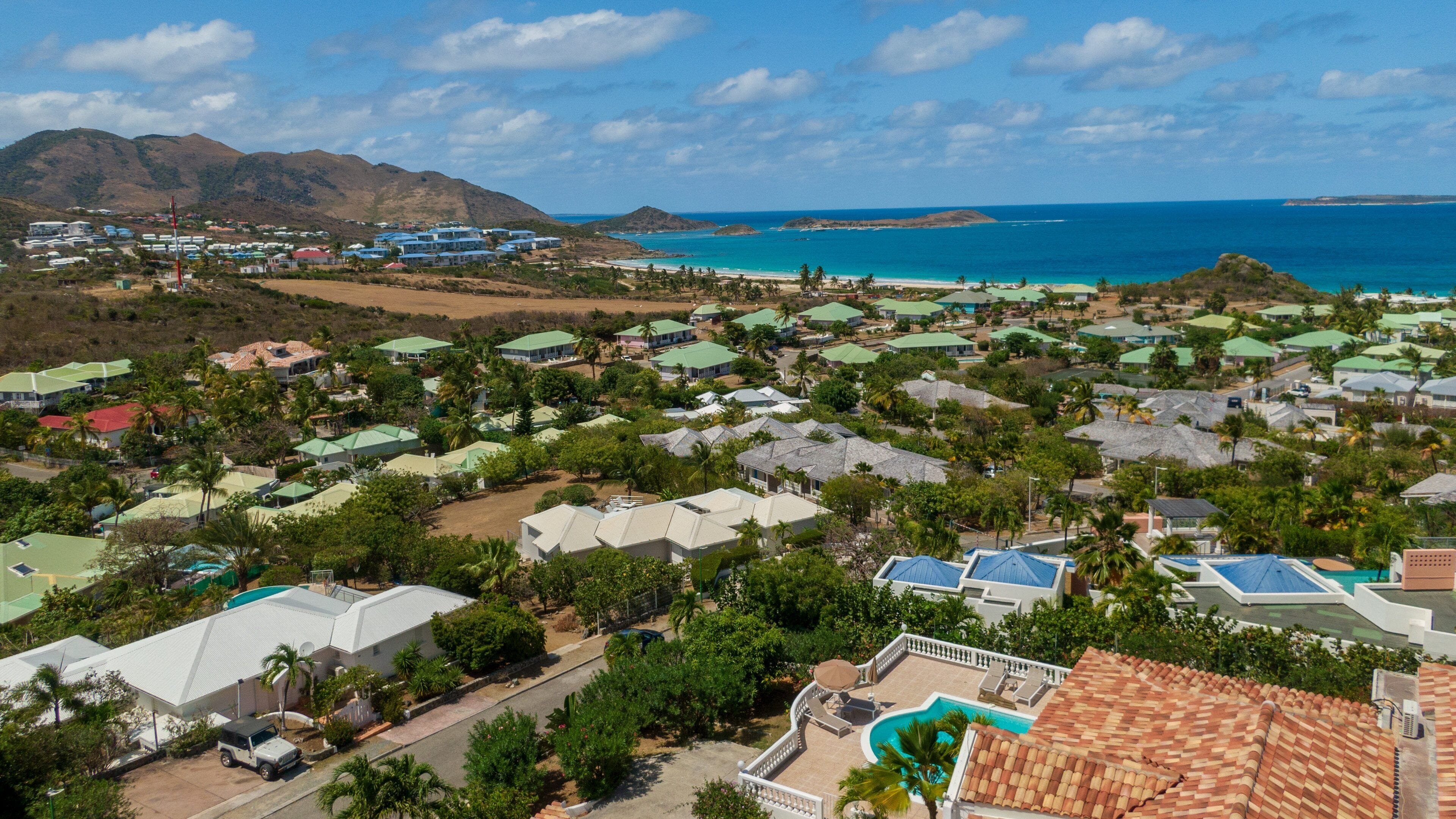 Orient Bay showing a coastal town and landscape views