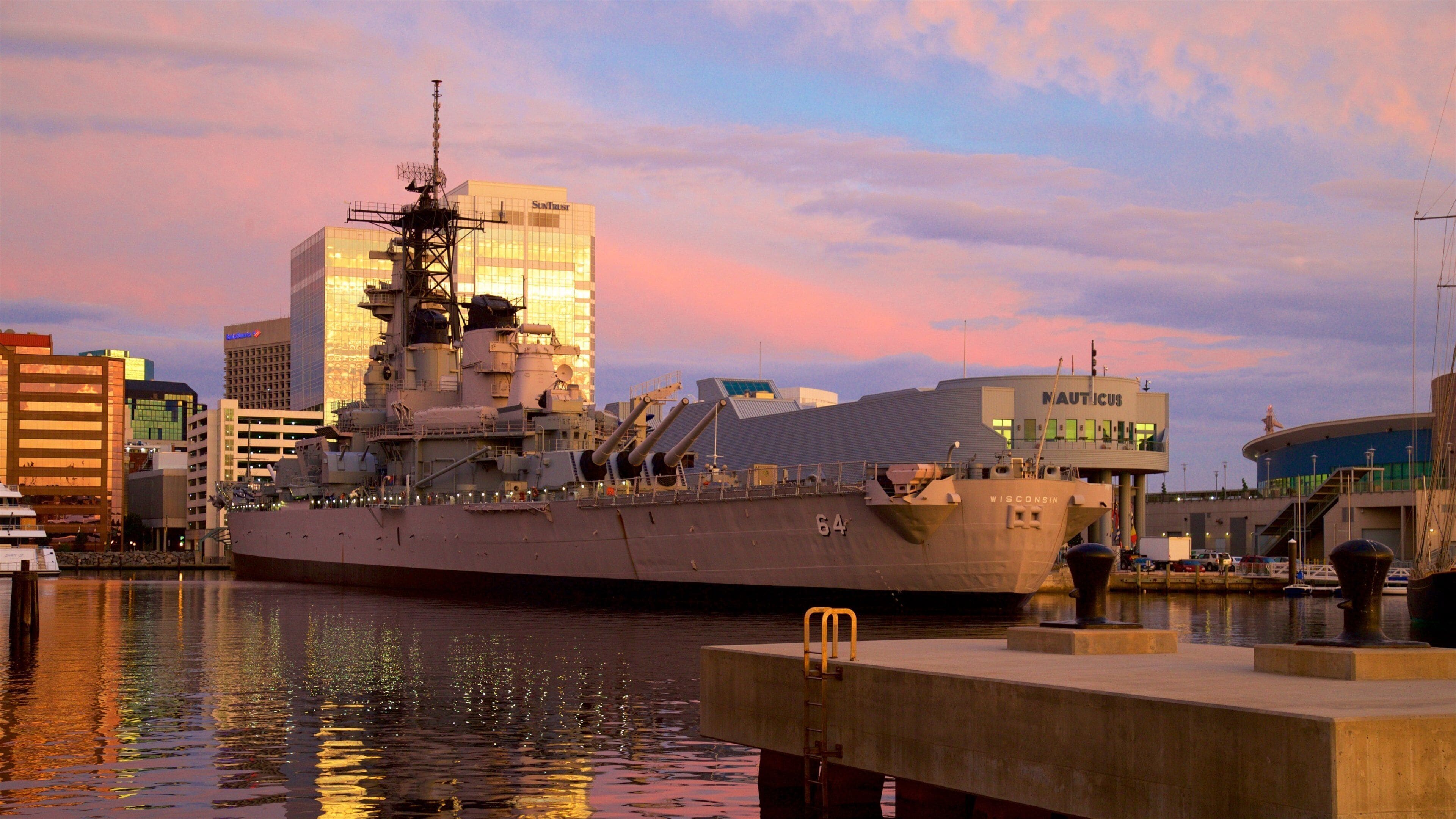 Norfolk - Virginia Beach showing a sunset, military items and a bay or harbour