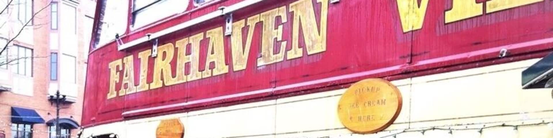 A red double-decker food truck with 'FAIRHAVEN' written on it.