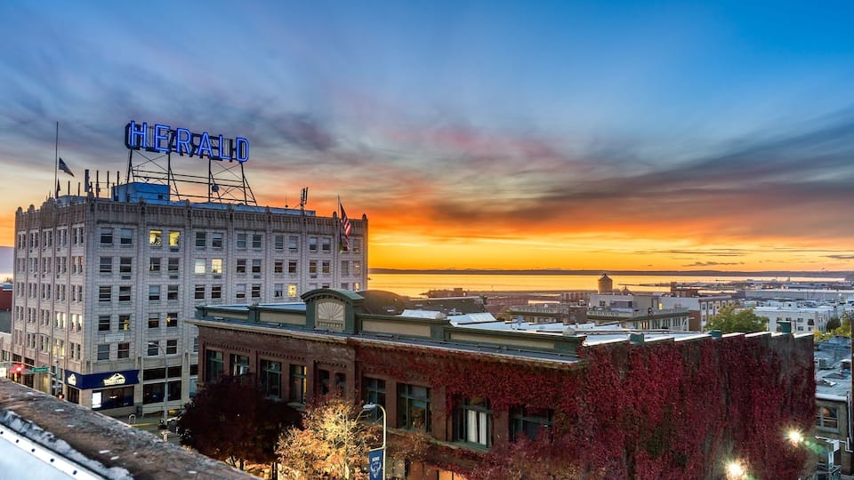 The old Herald building gets backlit as the sun sets over the San Juan islands. If your looking for some of the most beautiful sunsets find the pnw