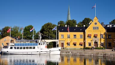 Motala featuring a river or creek, a small town or village and boating