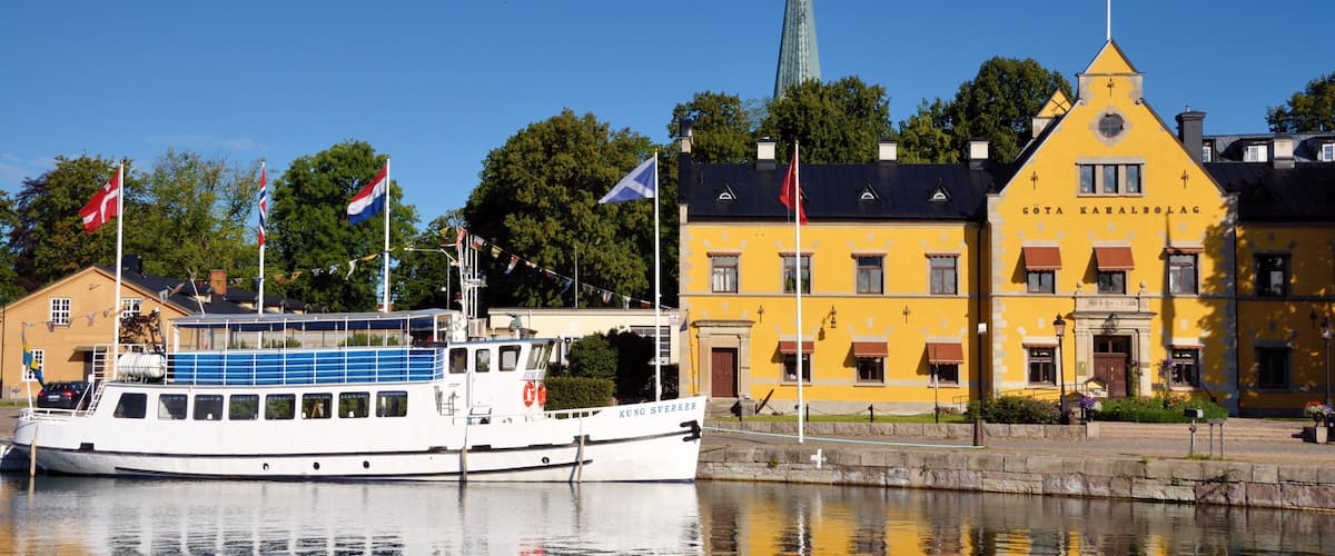 Motala featuring a river or creek, a small town or village and boating