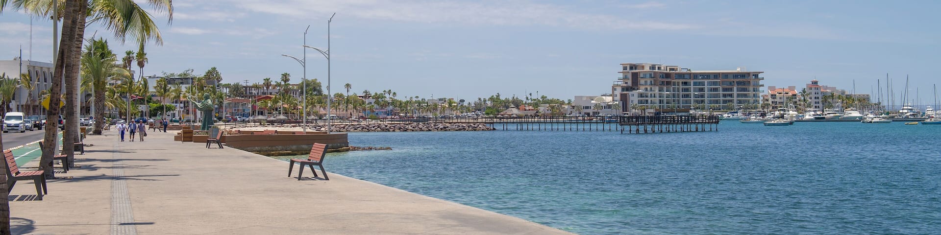 Panoramic view of boardwalk by the sea of cortes, the Malecon of La Paz on a sunny summer morning in the state of Baja California Sur. MEXICO. Baja Style vacations and tourism.