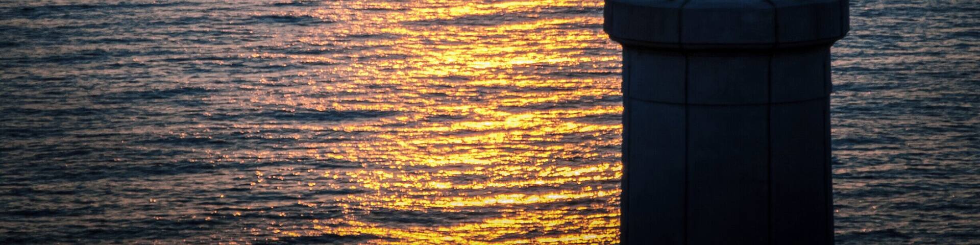 Sunrise at cape Palascìa. Cape Palascìa, commonly known as Capo d'Otranto, is Italy's most easterly point. It is situated in the territory of the Apulian city of Otranto, in the Province of Lecce at 40° 7' northing and 18° 31' easting.
The lighthouse there, recently renovated, is one of five Mediterranean lighthouses protected by the European Commission. It is often visited by tourists, especially at New Year, since it stands at the point where the dawn of the new year may first be seen in Italy.
According to nautical conventions, Capo d'Otranto marks the point where the Ionian Sea and the Adriatic Sea meet.