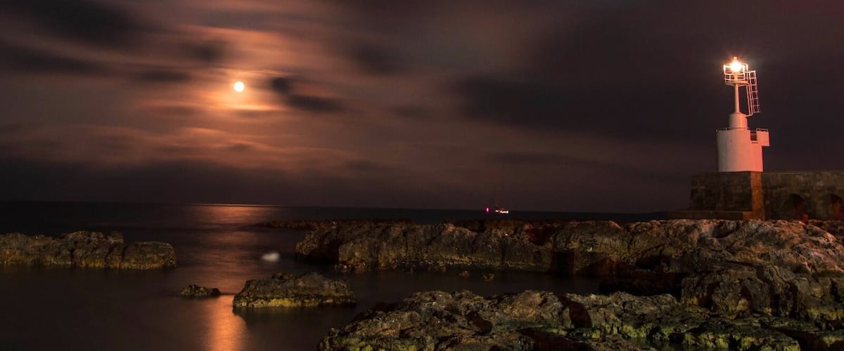 The lighthouse and the moon