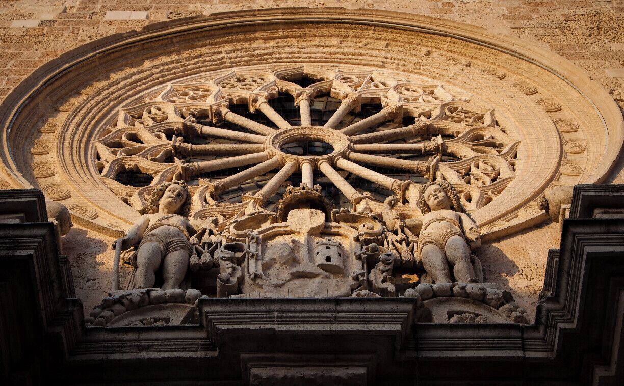 A particular of the facade of the Cathedral of Otranto. This small town, at the tip of Salento, is famous in  Mediterranean history for being besieged, conquered and sacked in 1480 by the Turks who attempted to build an Ottoman bridgehead on Christian Land. The last 800 men who withstood the attack were decapitated. The Otranto’s Martyrs’ skulls are stored in glass shrines by a side altar of the cathedral.  Muslims demolished its facade but they didn’t dare to destroy the inside, with its most precious treasure: a monumental mosaic covering the entire floor of the cathedral like a lavishly decorated carpet of colorful stones.