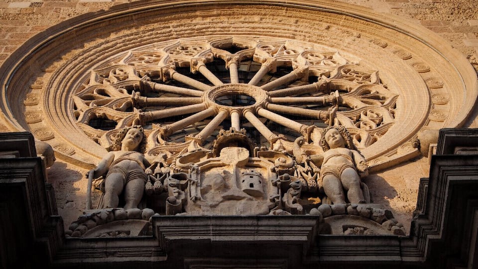 A particular of the facade of the Cathedral of Otranto. This small town, at the tip of Salento, is famous in Mediterranean history for being besieged, conquered and sacked in 1480 by the Turks who attempted to build an Ottoman bridgehead on Christian Land. The last 800 men who withstood the attack were decapitated. The Otranto’s Martyrs’ skulls are stored in glass shrines by a side altar of the cathedral. Muslims demolished its facade but they didn’t dare to destroy the inside, with its most precious treasure: a monumental mosaic covering the entire floor of the cathedral like a lavishly decorated carpet of colorful stones.
