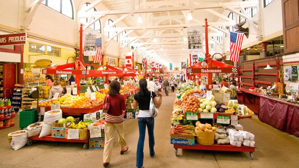 Saint John which includes interior views and markets as well as a small group of people