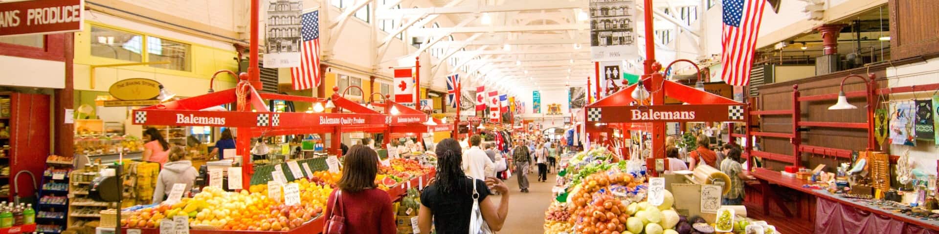 Saint John featuring markets and interior views as well as a small group of people