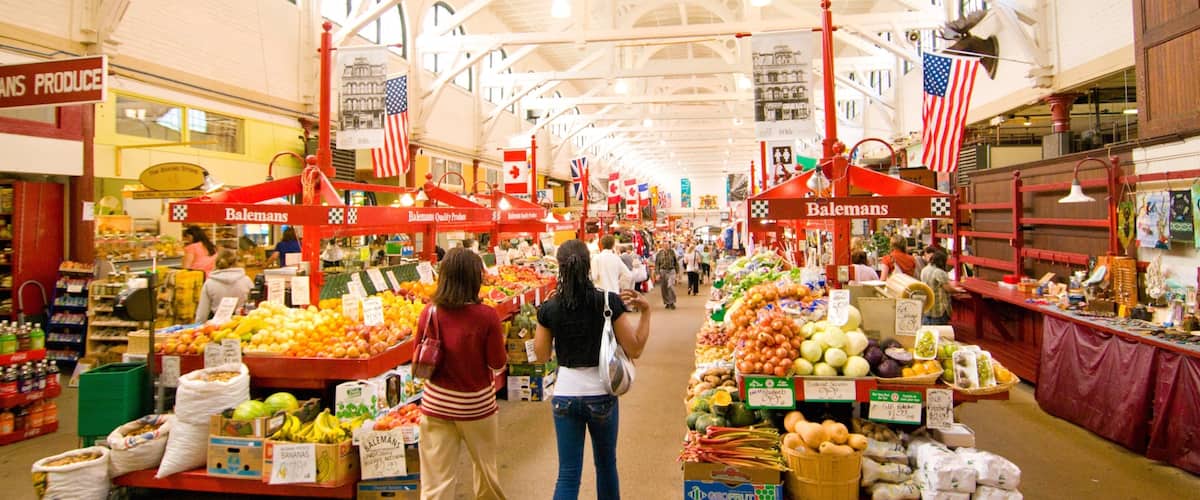 Saint John which includes interior views and markets as well as a small group of people