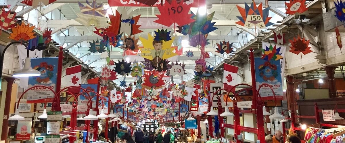 All decked out with mobiles made by local school children celebrating Canada's 150th  the City Market is filled with food and souvenirs.
